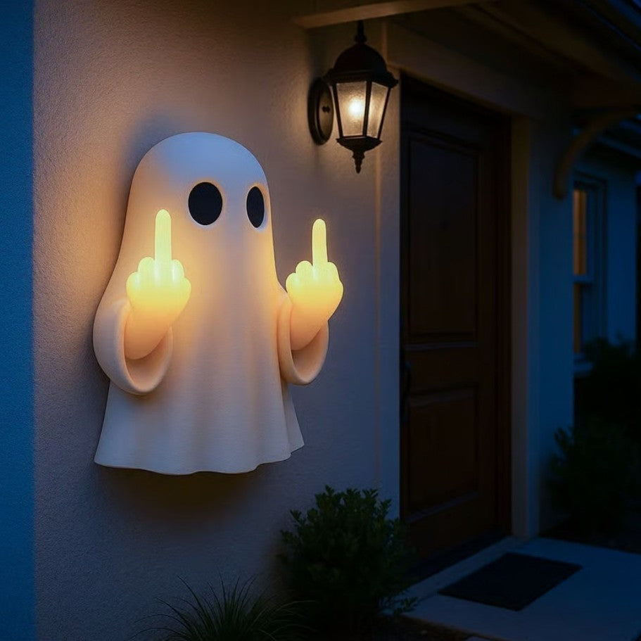 Halloween ghost with a glowing night light on its middle finger