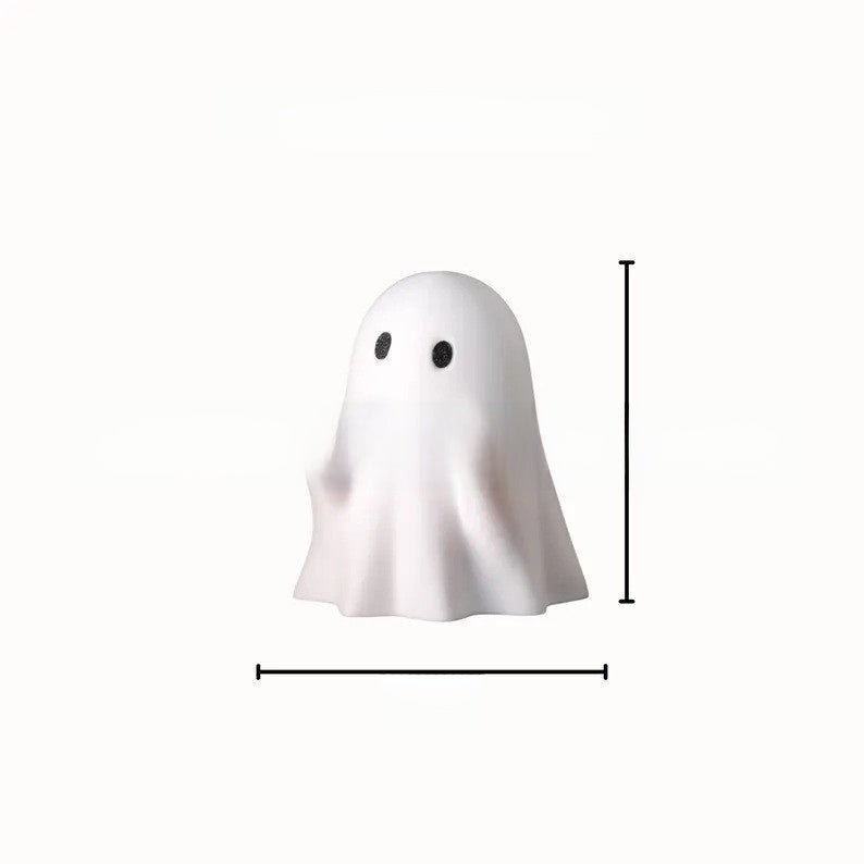 Halloween ghost with a glowing night light on its middle finger