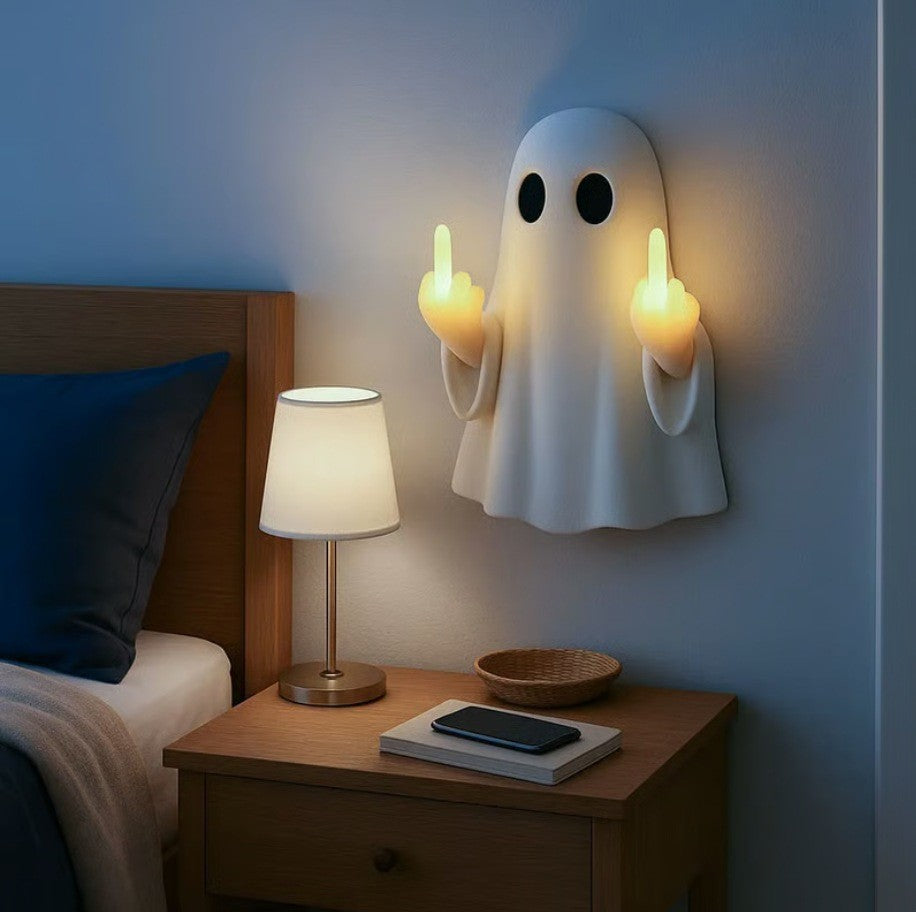 Halloween ghost with a glowing night light on its middle finger